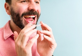 a person putting ClearCorrect aligners in their mouth