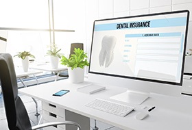 Dental insurance form on desktop in office