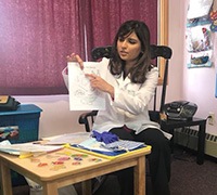 Dentist showing patient paperwork