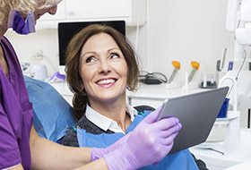 Dentist and patient looking at treatment plan