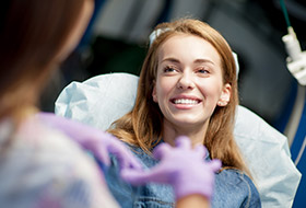 Smiling woman in dental chair