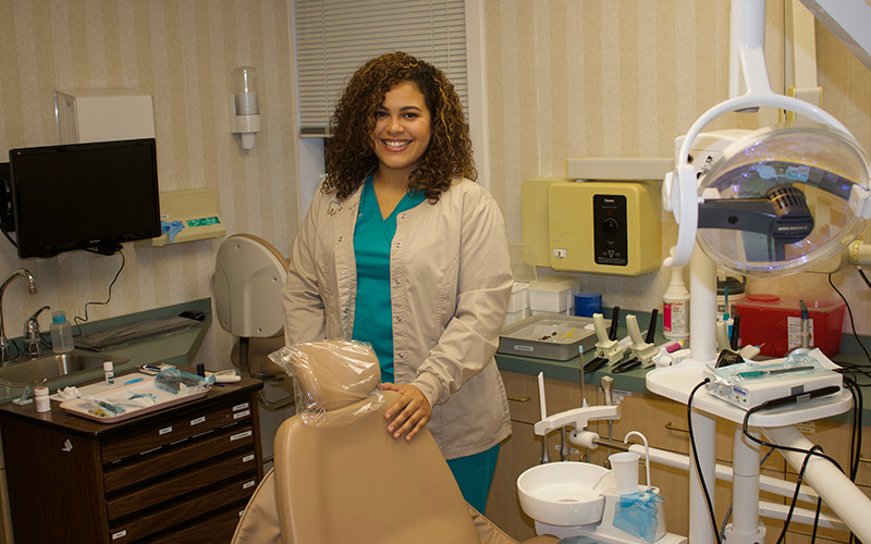 Dental assistant in exam room