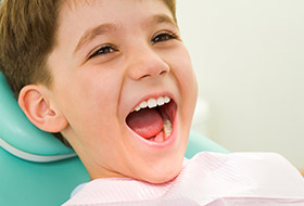 Smiling child in dental chair