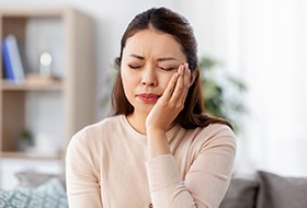 Patient experiencing toothache at home