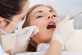 A young woman getting a dental checkup