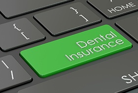 a keyboard with a dental insurance button