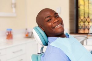 Man smiling in dental chair