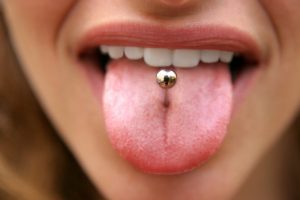 girl with tongue piercing