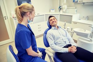 man at checkup with dentist