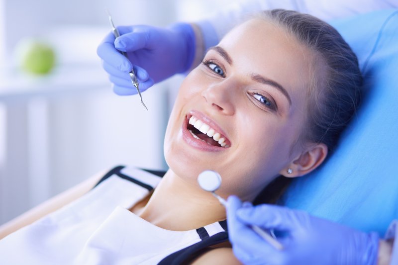 Patient smiling with dentist