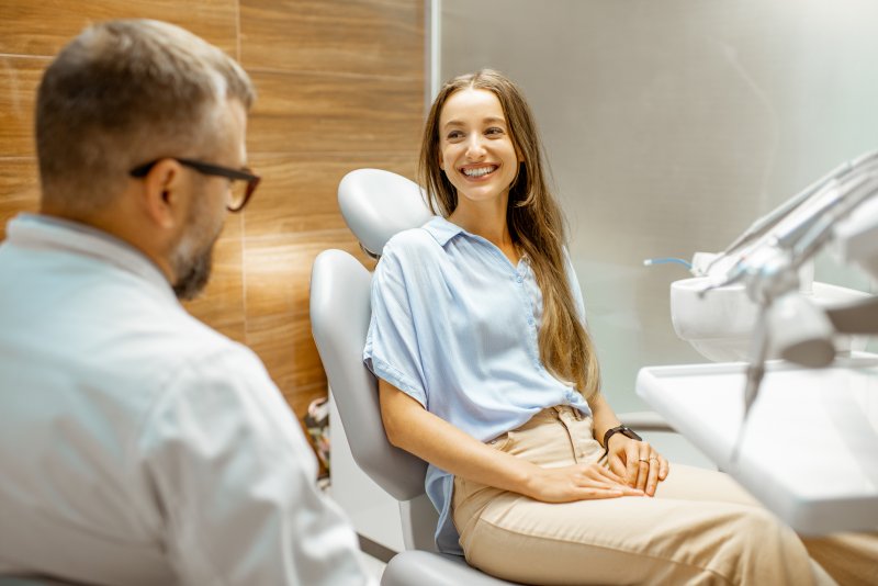 Female patient talking to dentist