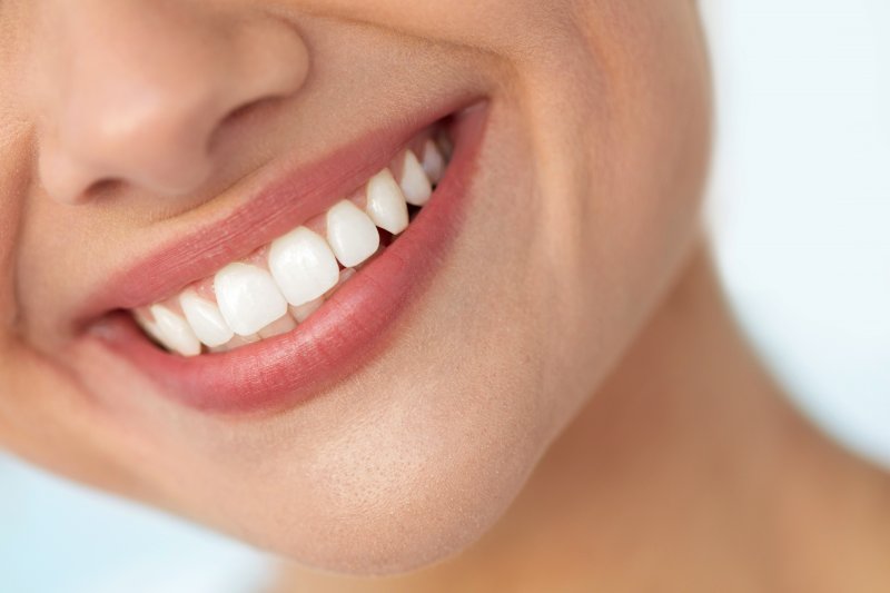 Woman smiling with white, straight teeth