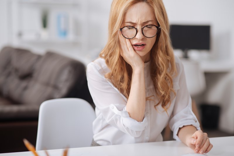 Woman with tooth pain