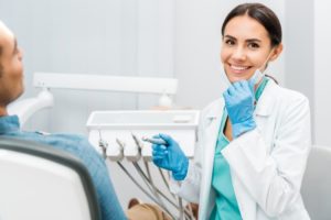 female dentist smiling toward the camera 