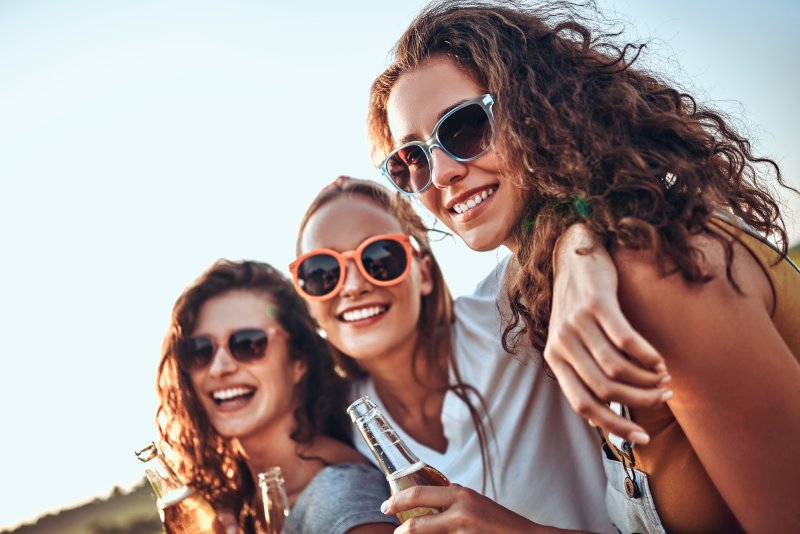 women smiling during summer vacation
