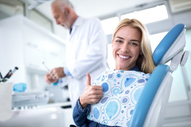 Woman at dentist's office for cosmetic treatment.