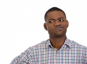 Man pressing his lips together in a questioning expression